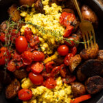Closeup of a fork in a skillet of Vegan Breakfast Eggs with Potatoes
