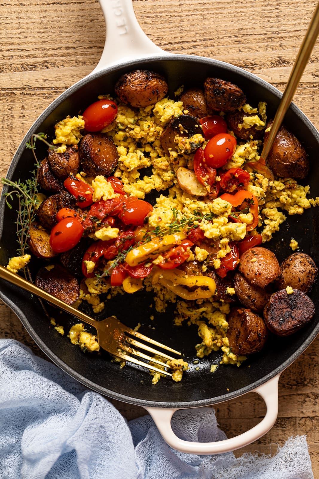 Partially eaten Vegan Breakfast Eggs with Potatoes in a skillet