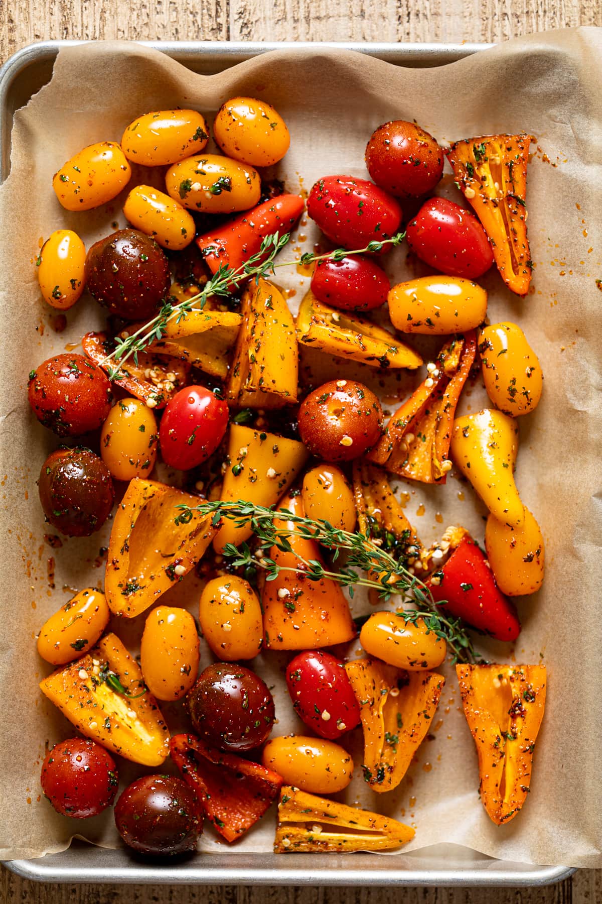 Seasoned vegetables on a baking sheet