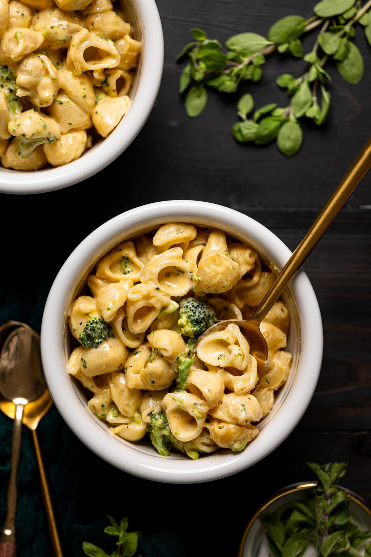 Copycat Velveeta Broccoli Mac + Cheese in a bowl with a spoon