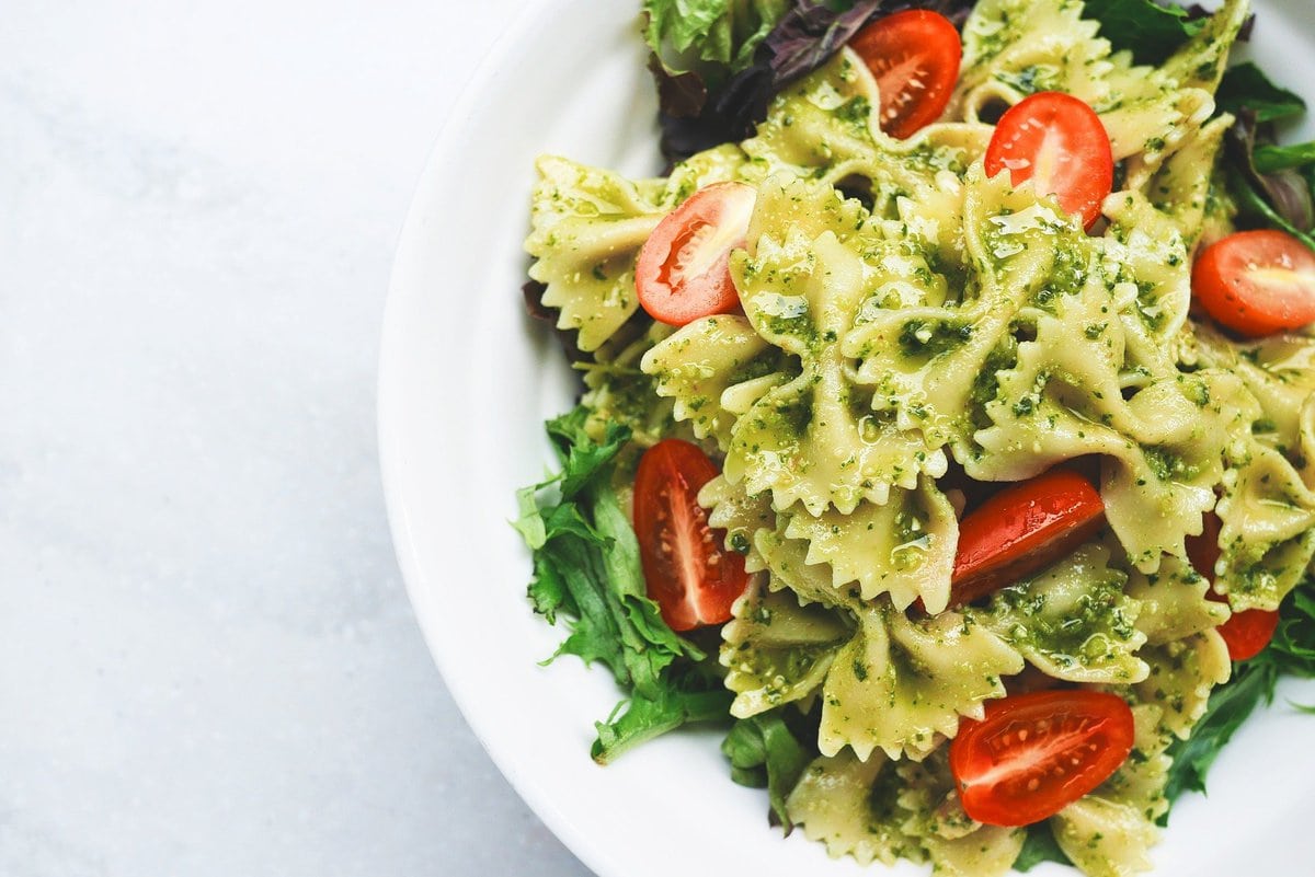 Plate of pesto pasta with tomatoes