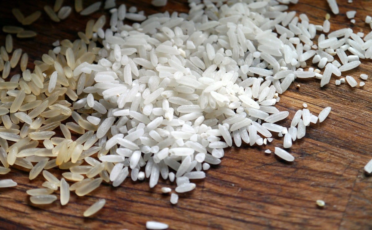 Grains of rice on a wooden surface