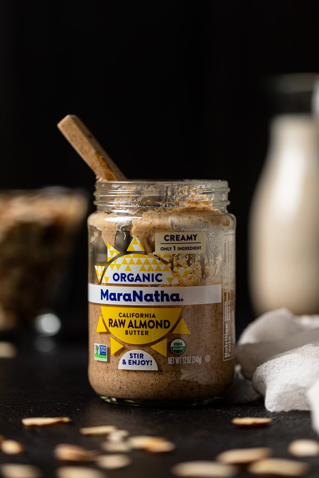 Half-empty jar of organic raw almond butter