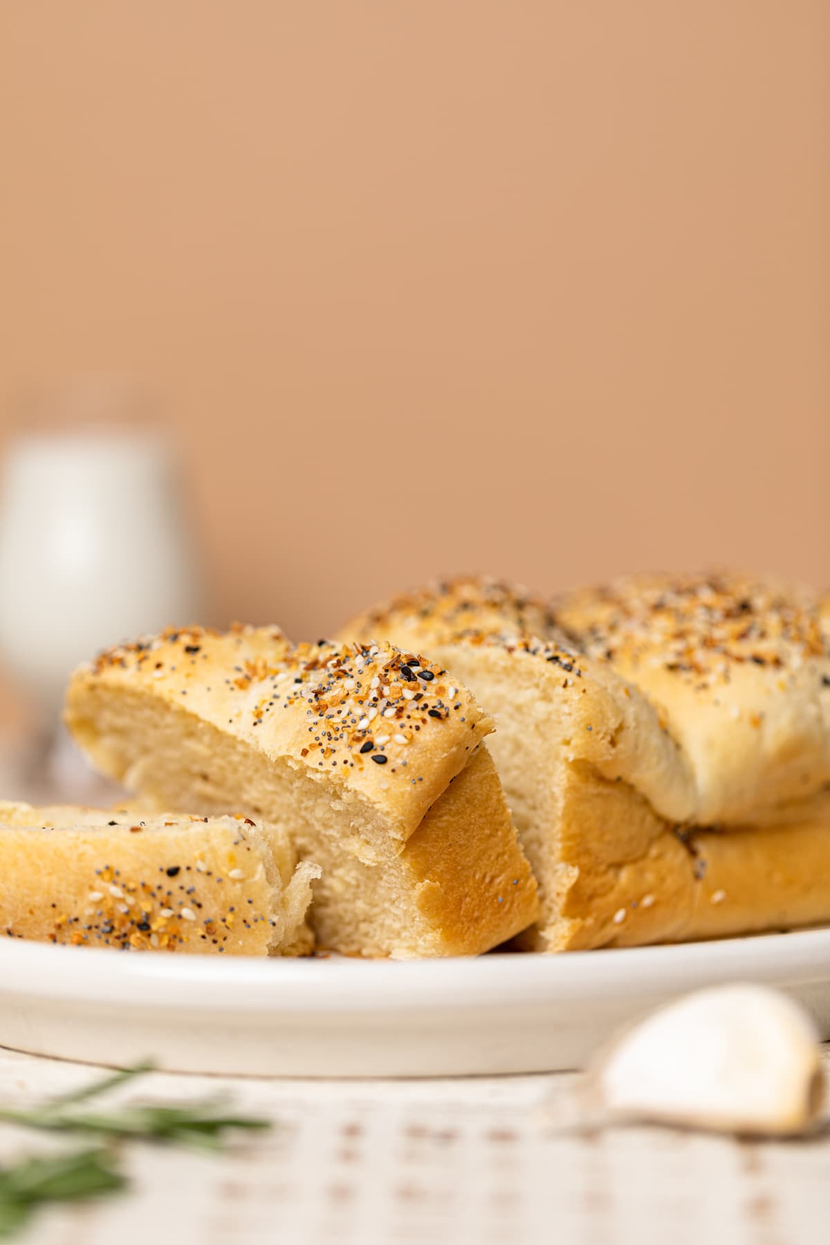 Partially-sliced loaf of Vegan Everything Bagel Brioche Bread 