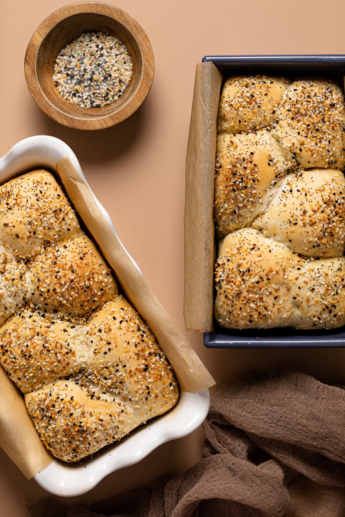 Overhead shot of two pans of Vegan Everything Bagel Brioche Bread 