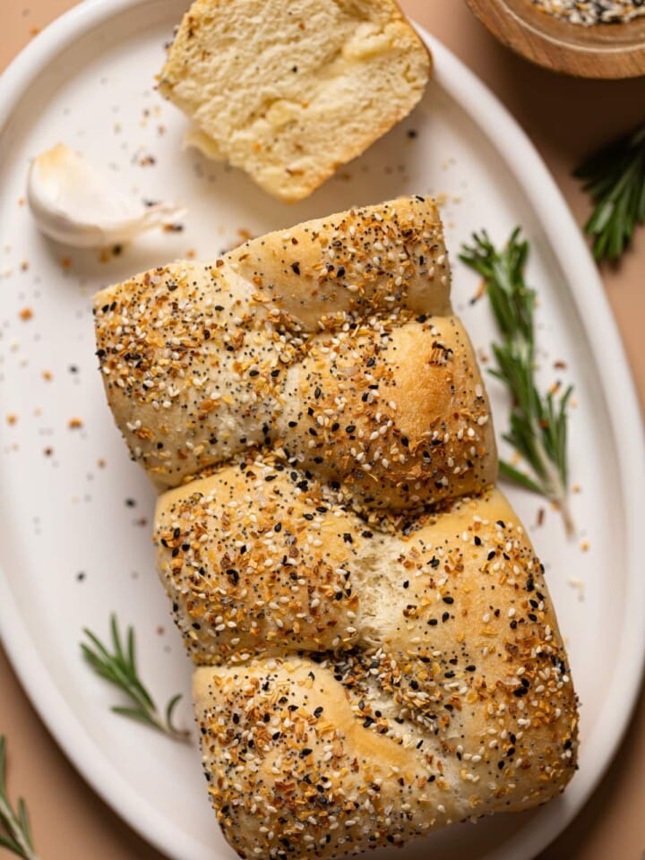 Overhead shot of a loaf of Vegan Everything Bagel Brioche Bread with an end sliced off