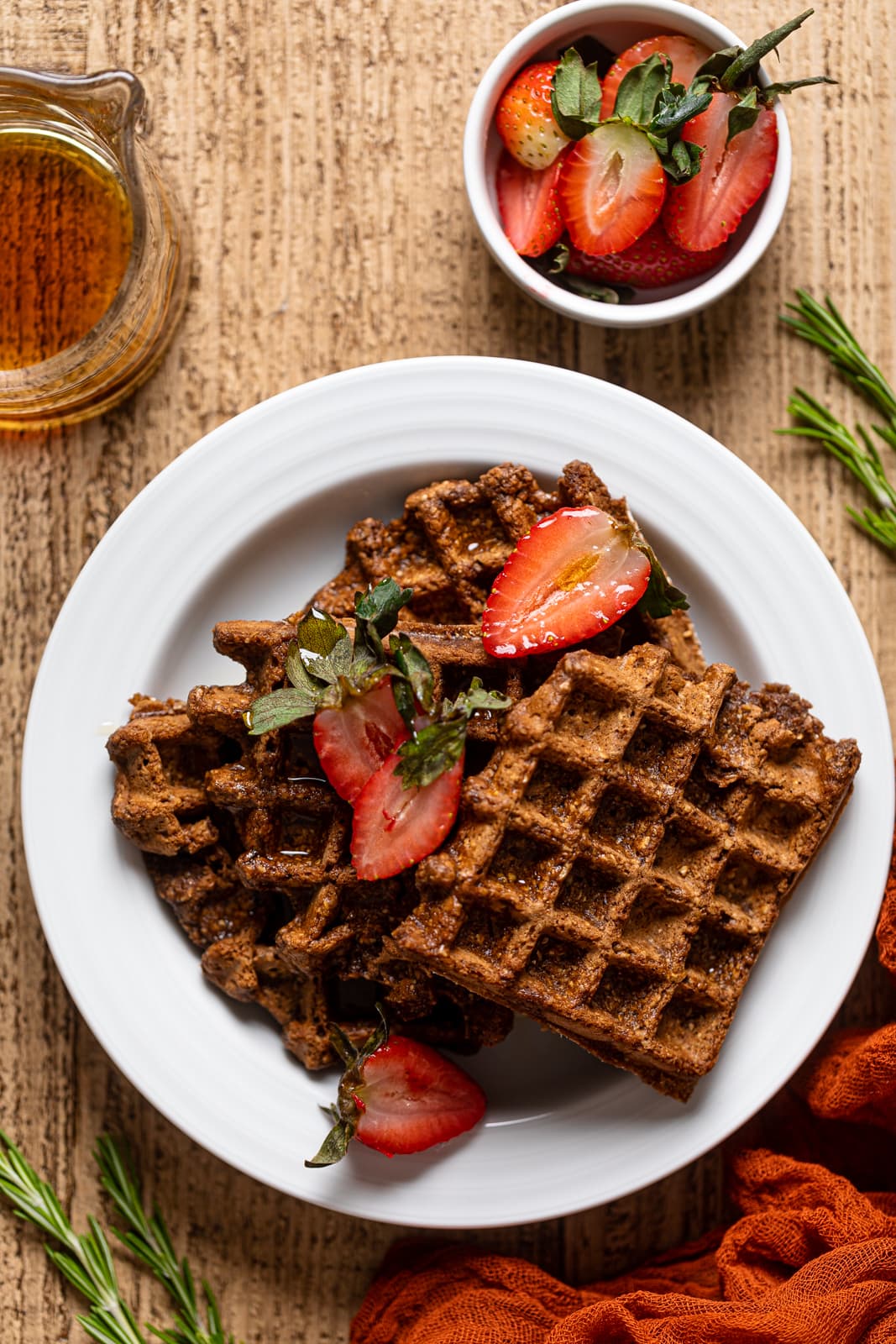 Overhead shot of a plate of Flourless Espresso Chocolate Waffles with Strawberries