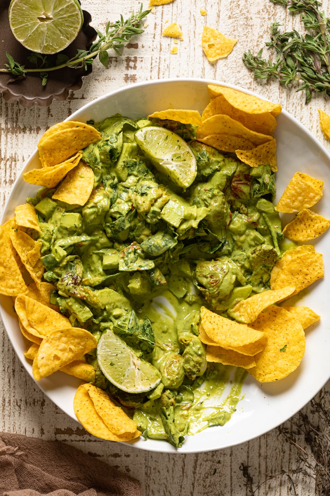 Half-eaten plate of Green Goddess Salad Dip with chips