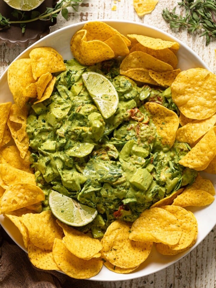 Overhead shot of Green Goddess Salad Dip surrounded by chips