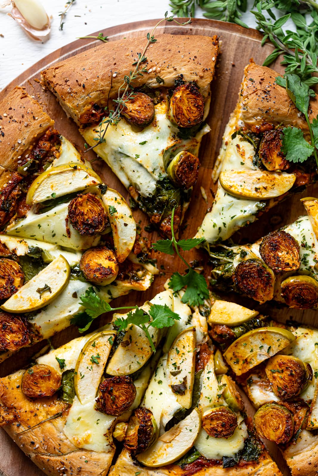 Closeup of a sliced All Green Pesto Veggie Pizza 