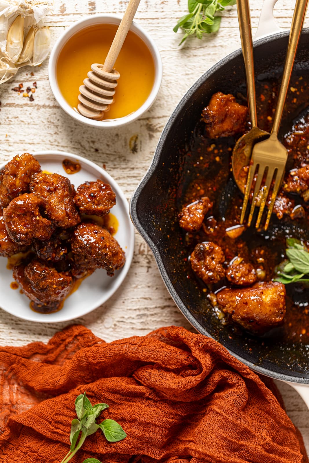 Small plate and skillet of Southern Hot Honey Cauliflower Bites