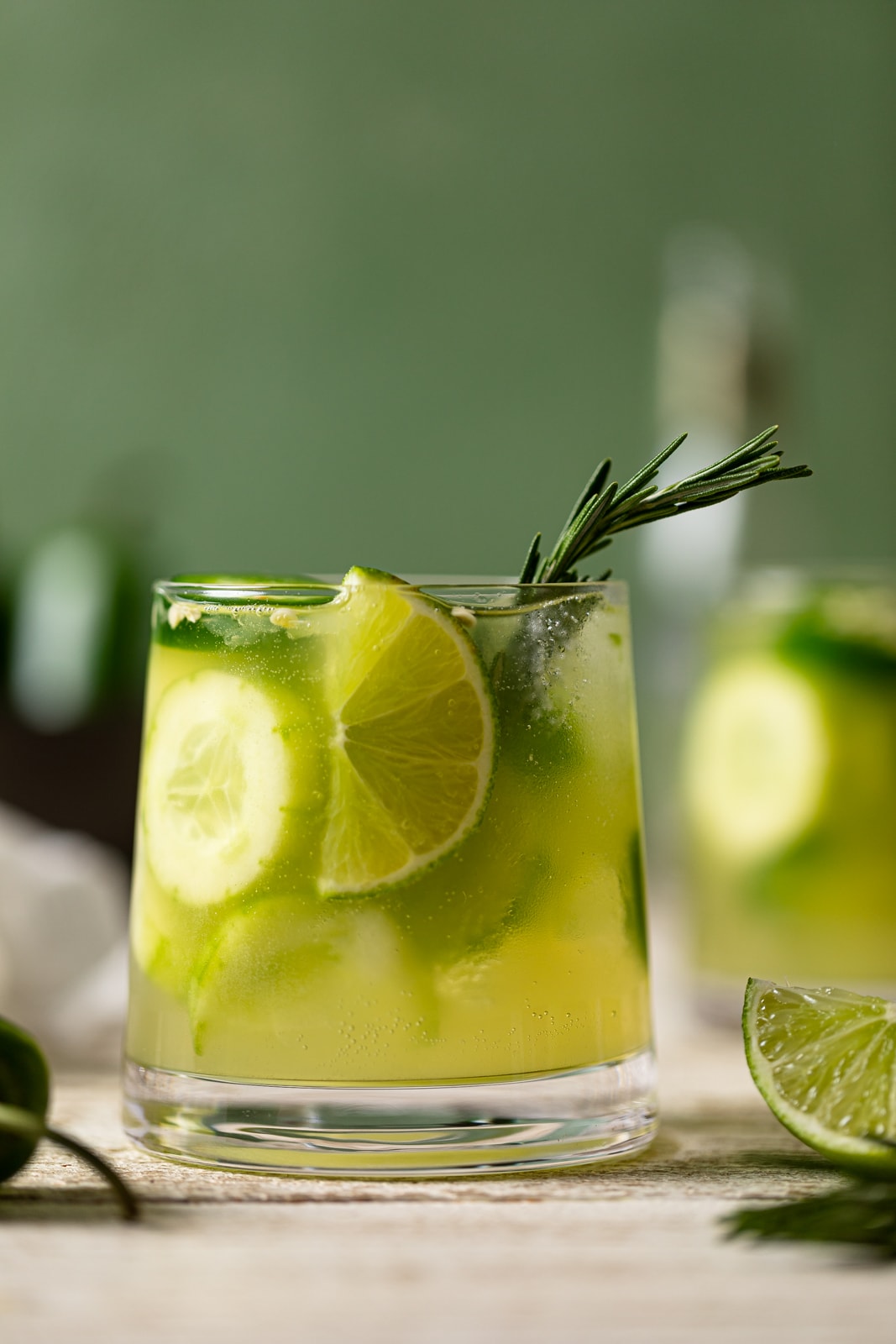 Bright green Spicy Cucumber Mocktail in a small glass