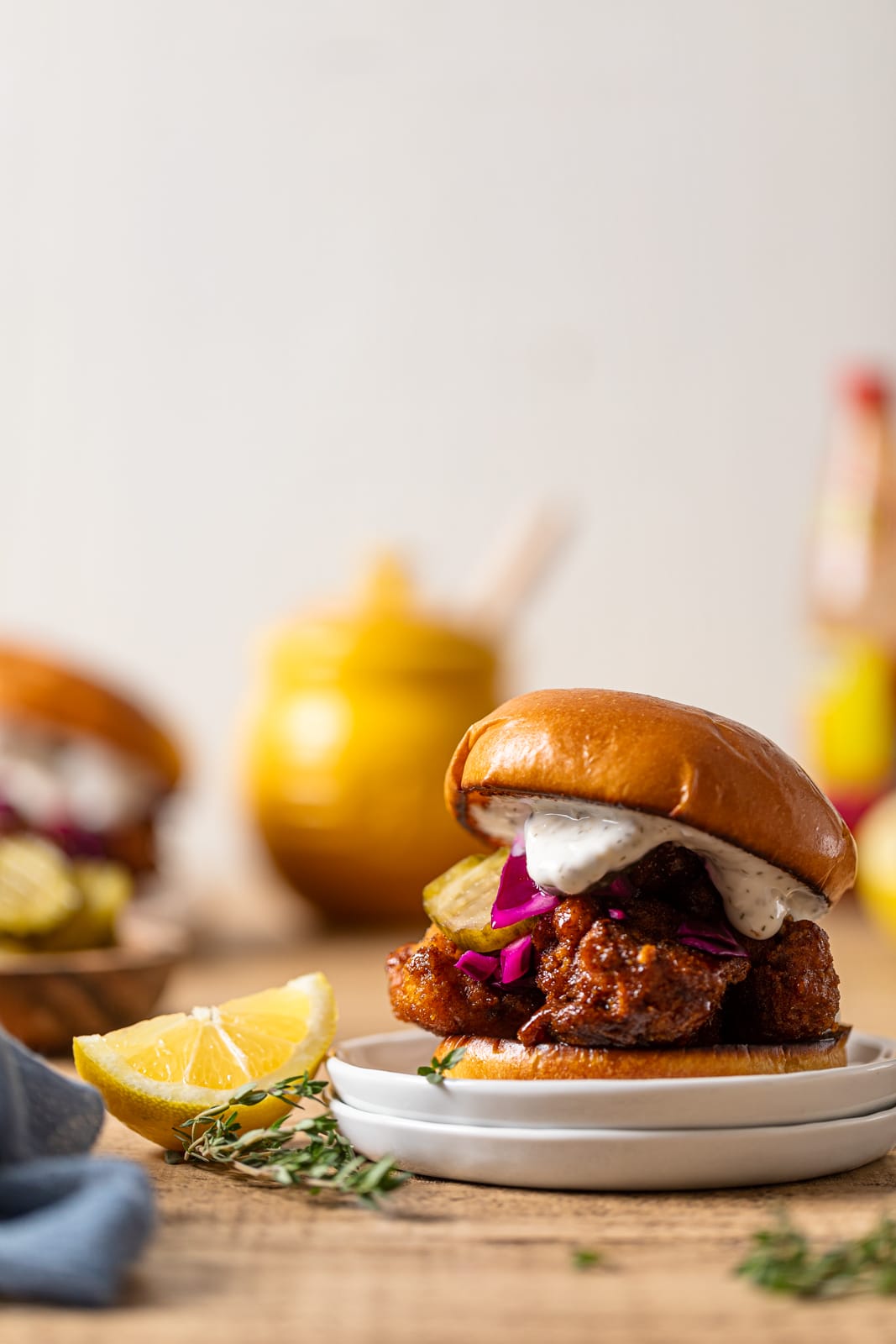 Vegan Chicken Burger next to a lemon wedge