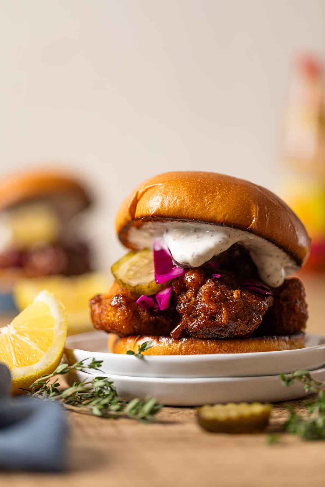 Nashville-Style Hot Cauliflower Burger on two small, stacked plates