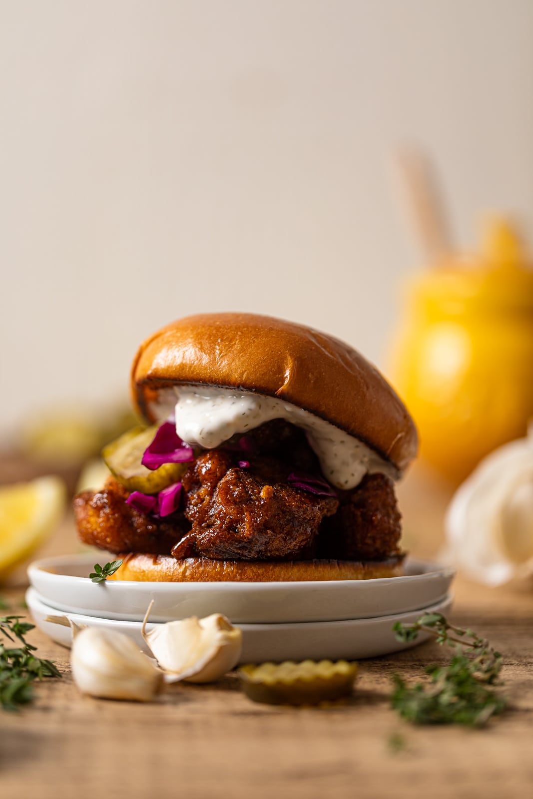 Nashville-Style Hot Cauliflower Sandwich on two small, stacked plates