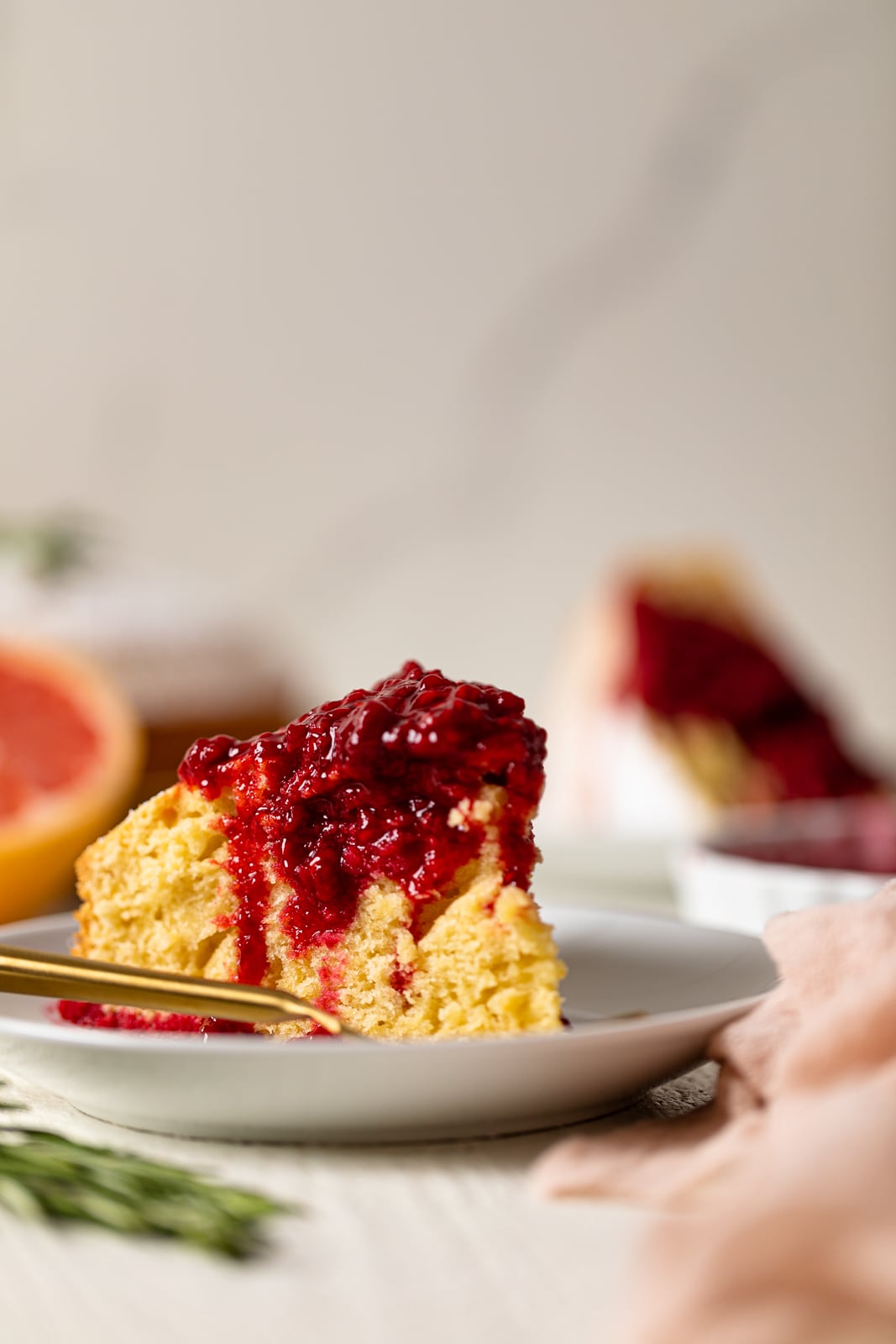 Slice of Grapefruit Olive Oil Cake with Raspberry Compote