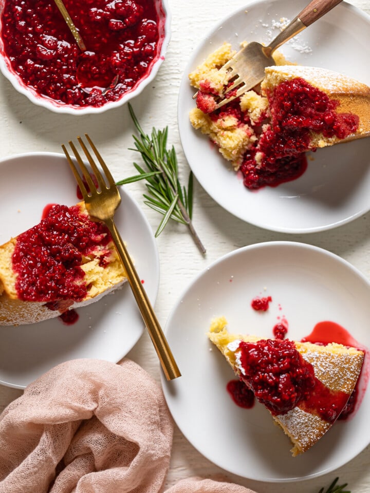 Slices of Grapefruit Olive Oil Cake with Raspberry Compote on small plates