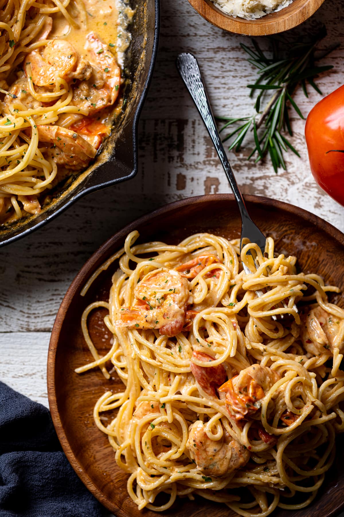 Wooden plate of Parmesan Garlic Shrimp Scampi with Linguine