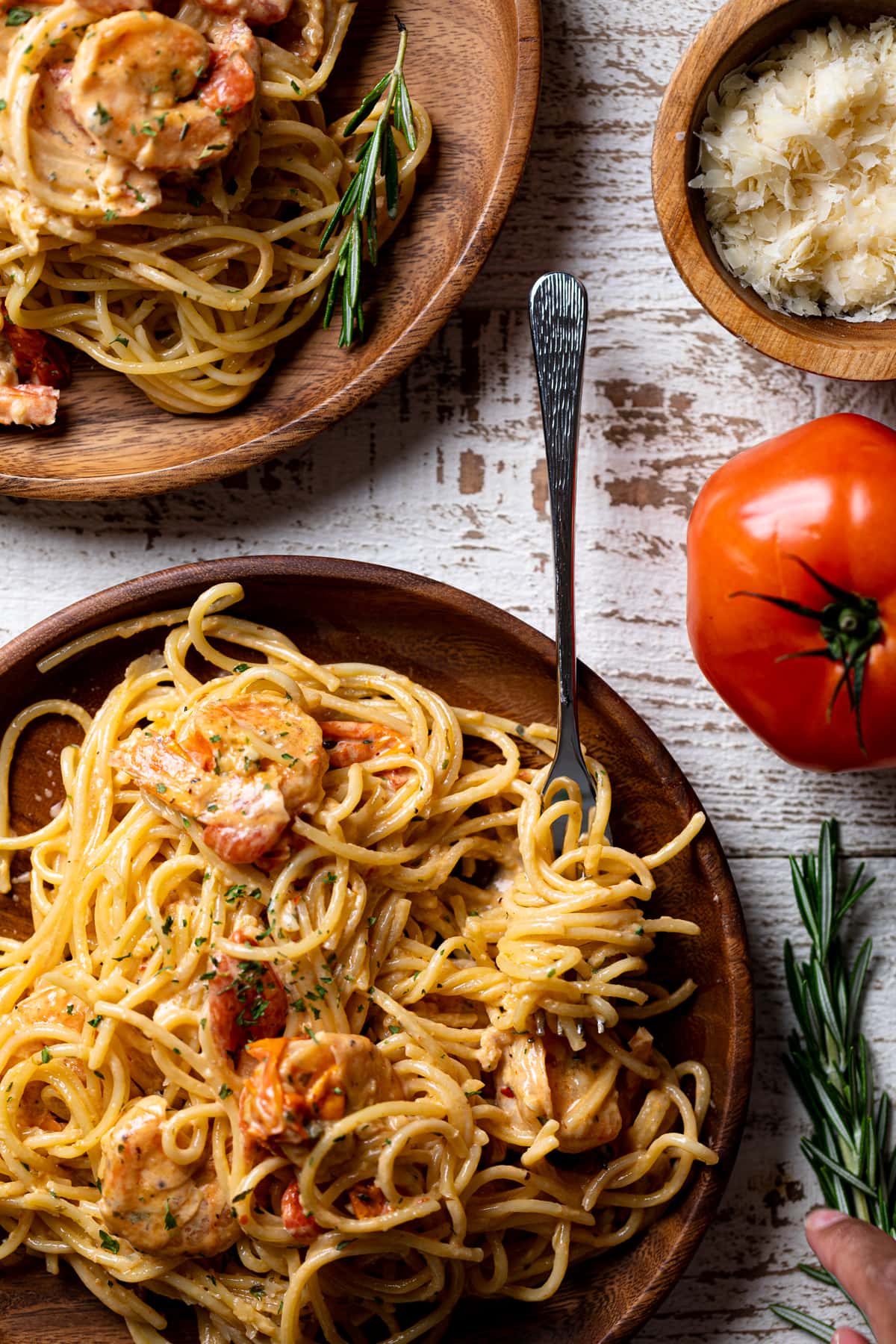 Wooden plate of Shrimp Scampi with Linguine with a fork/ The perfect Weeknight Dinner