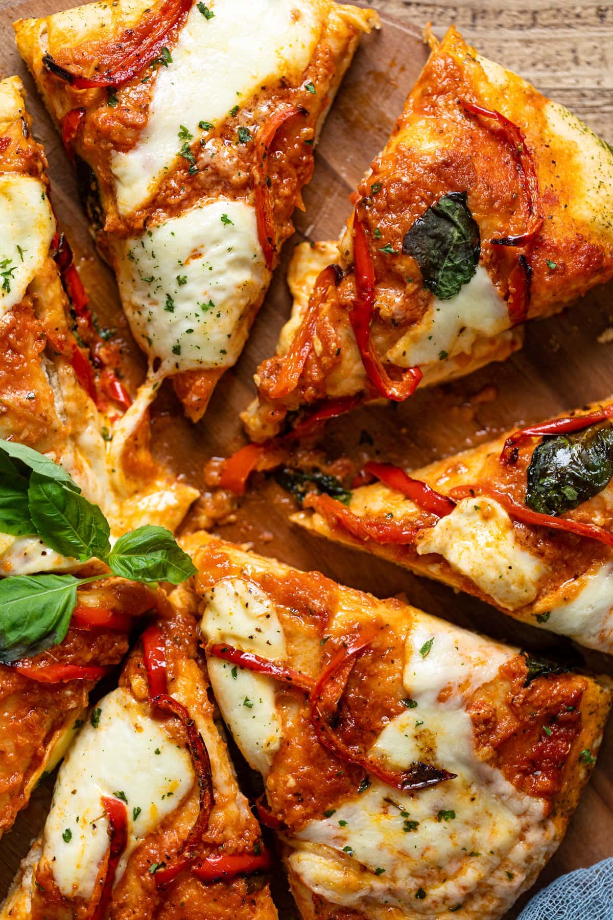 Closeup of sliced Vodka Pizza on a wooden board