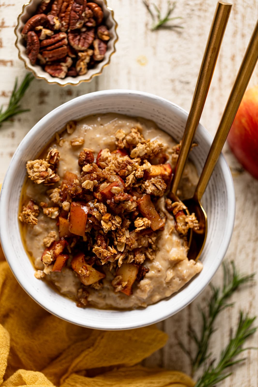 Bowl of Breakfast Apple Crumble Oatmeal with two spoons