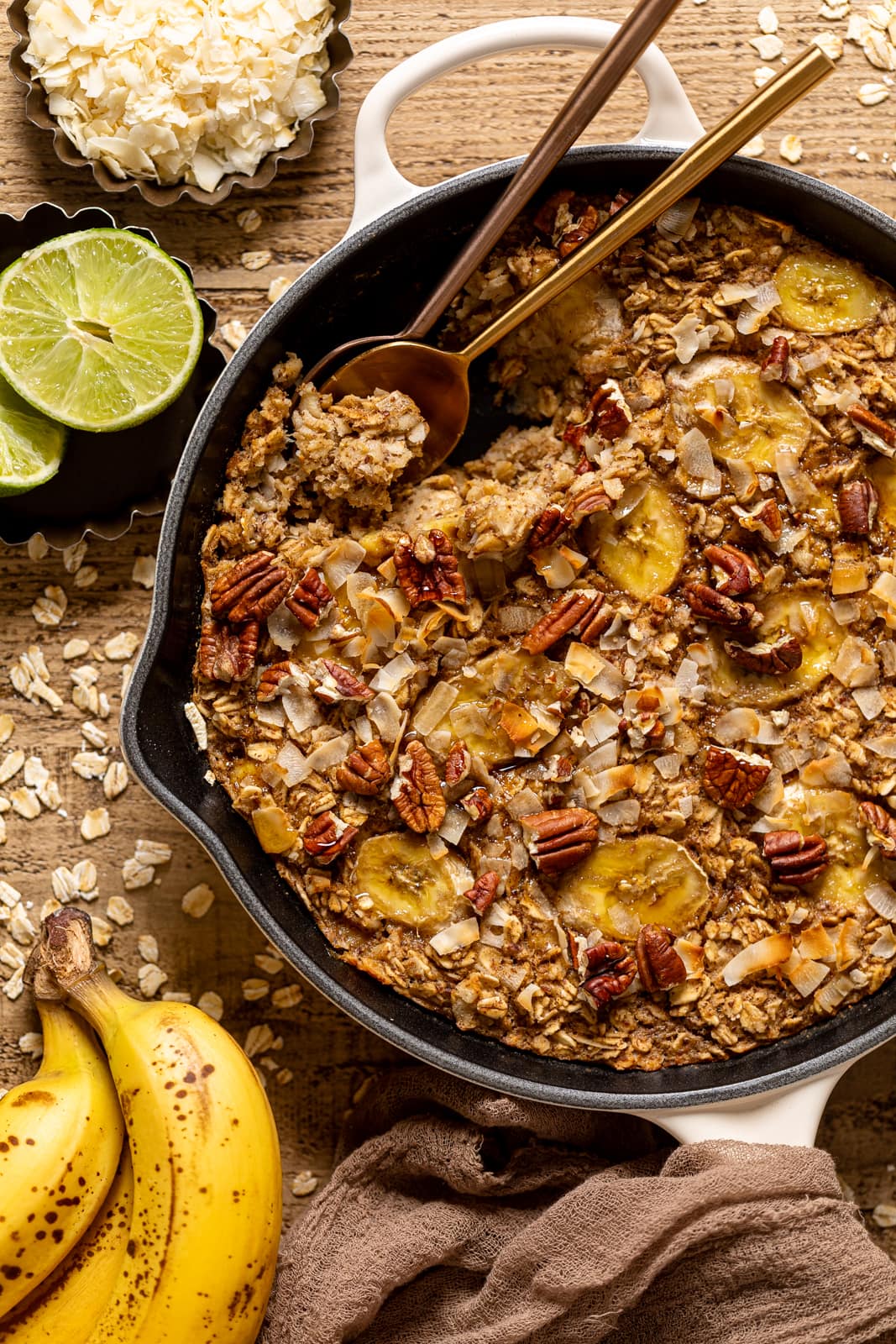 Overhead shot of a skillet of Jamaican-inspired Banana Bread Baked Oatmeal