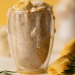 Closeup of an overflowing glass of Banana Coconut Overnight Oats
