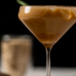 Caramel Oat Latte Mocktail in a long-stemmed glass