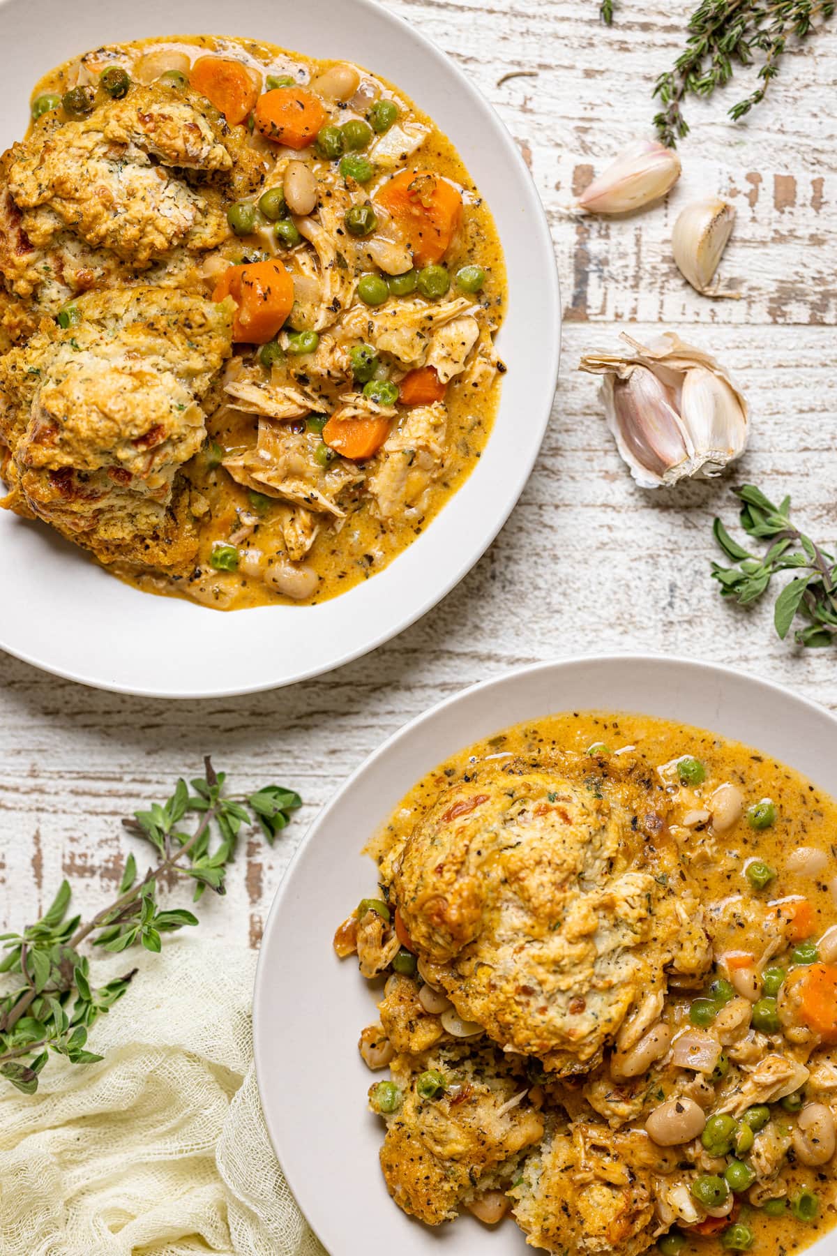 Two plates of Chicken Pot Pie with Cheddar Herb Biscuits