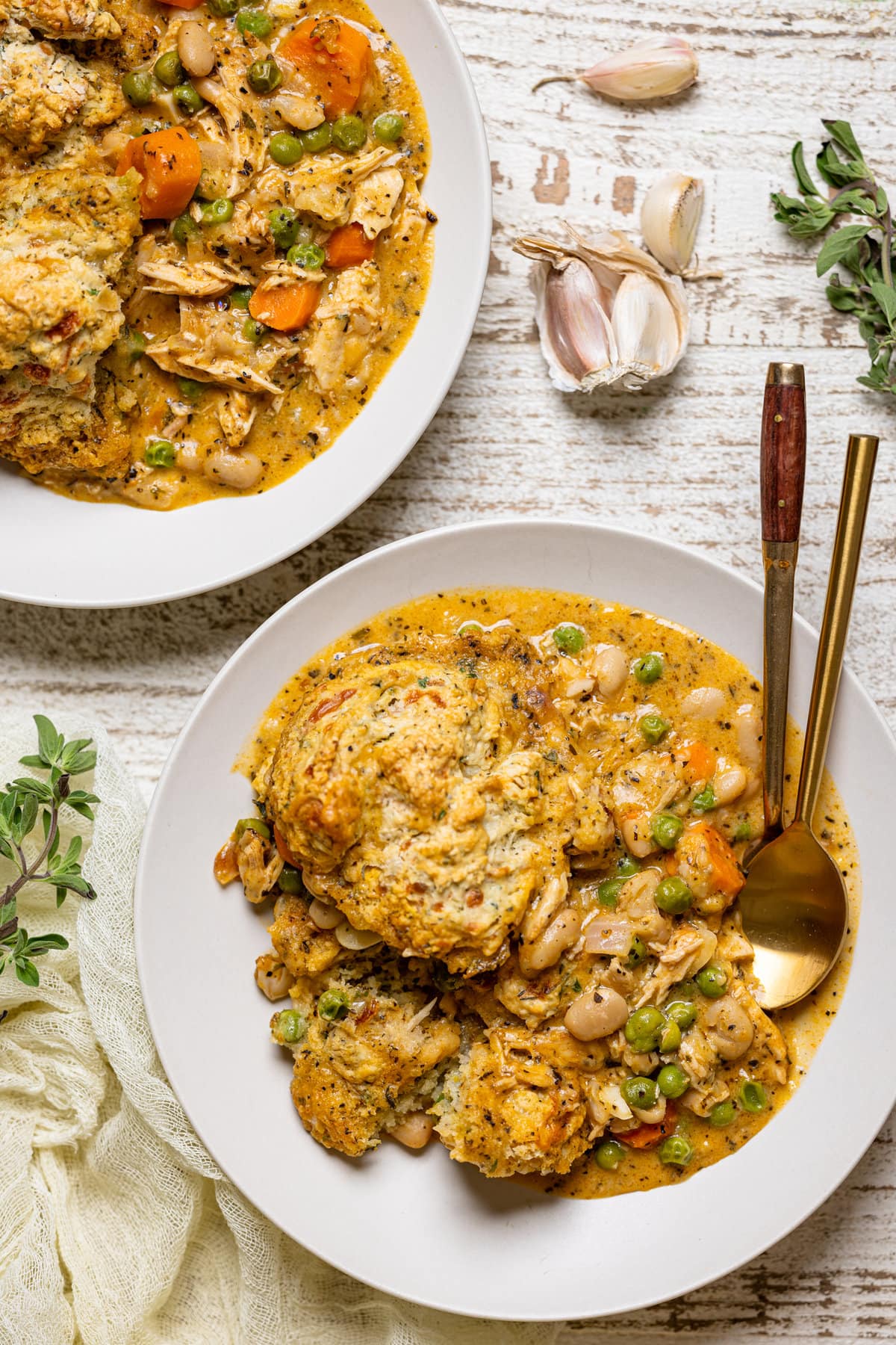 Two plates of Chicken Pot Pie with Cheddar Herb Biscuits