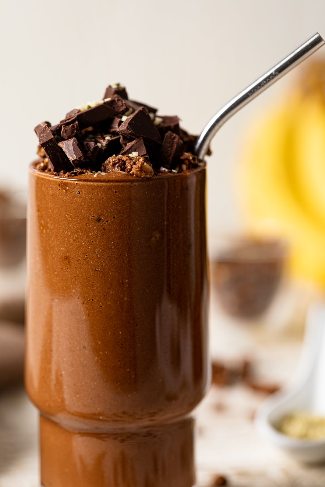 Closeup of a Chocolate Banana Smoothie with Espresso topped with chocolate pieces