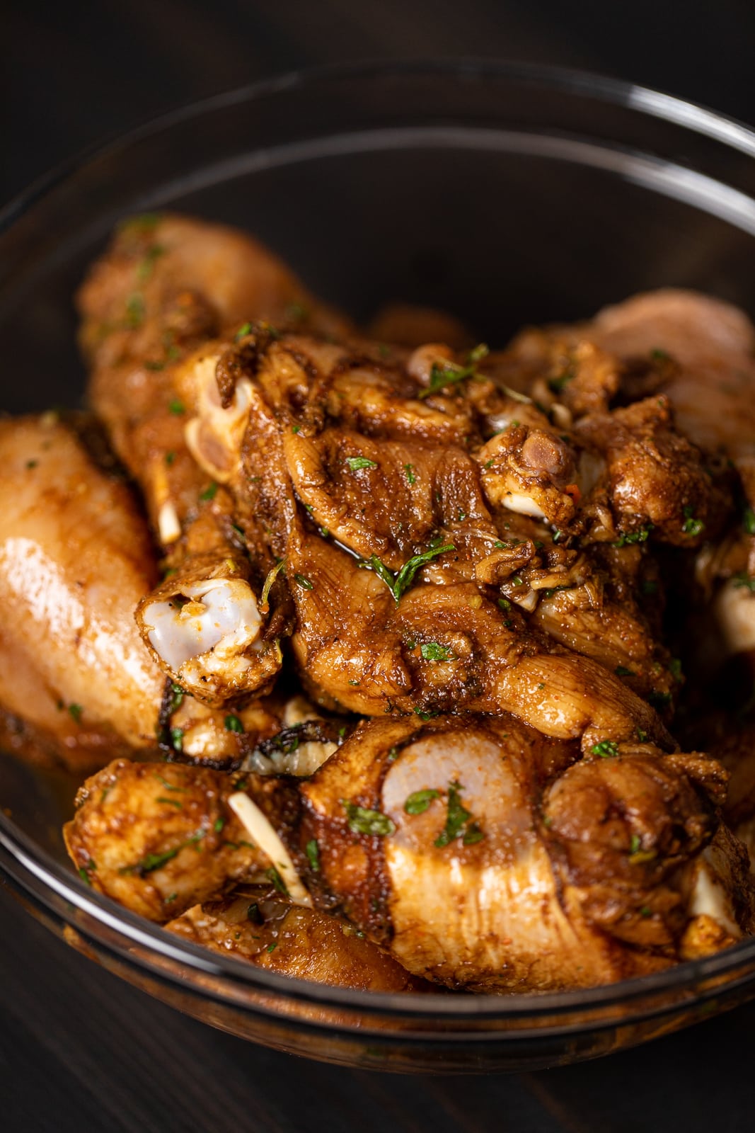 Closeup of uncooked Jamaican curry chicken