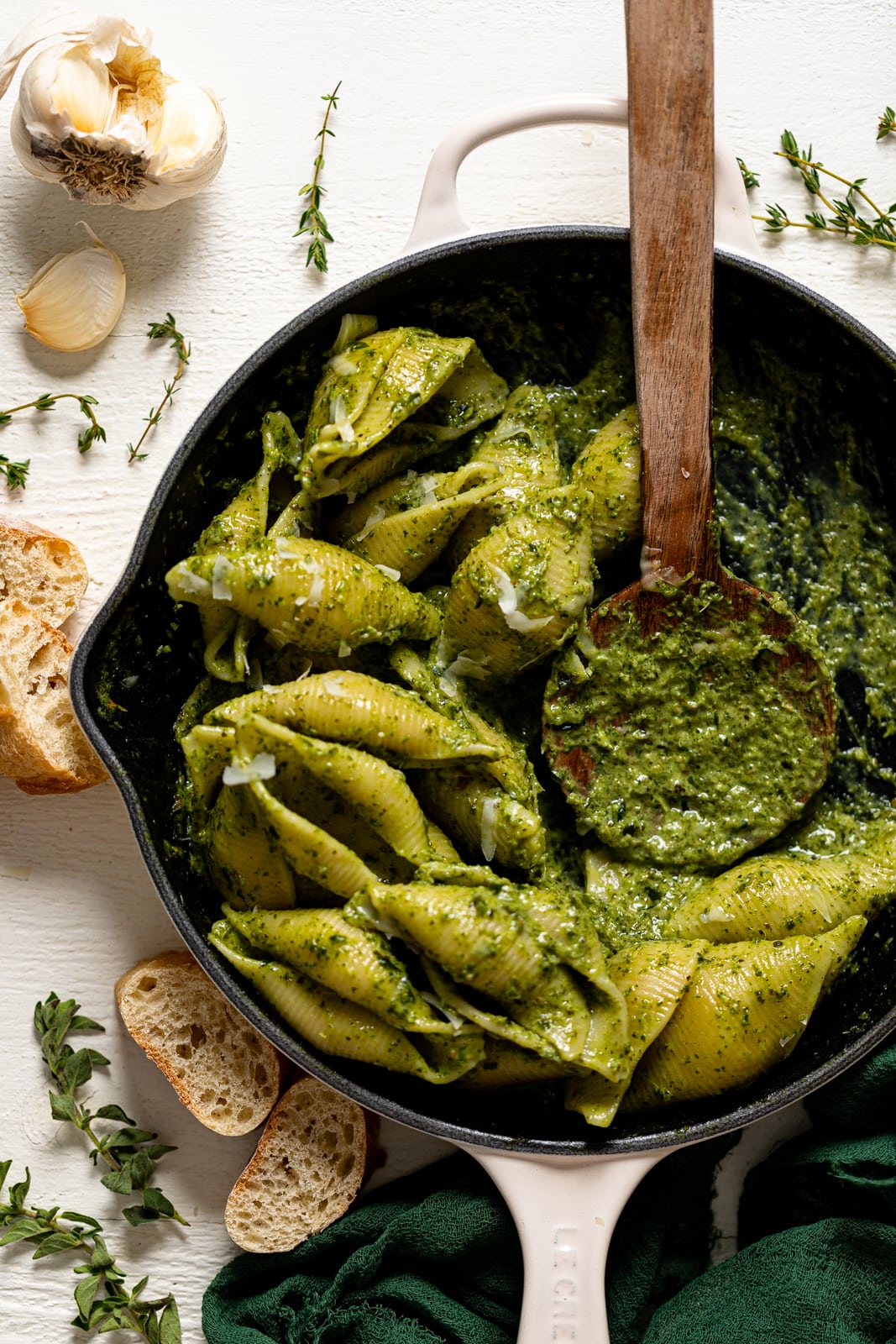 Half-served pan of Creamy Roasted Garlic Kale Pasta with Parmesan