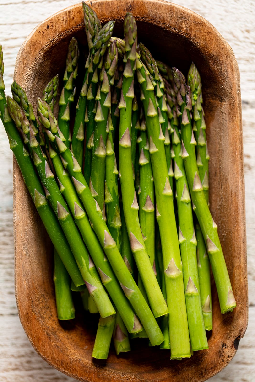 Wooden bowl of asparagus