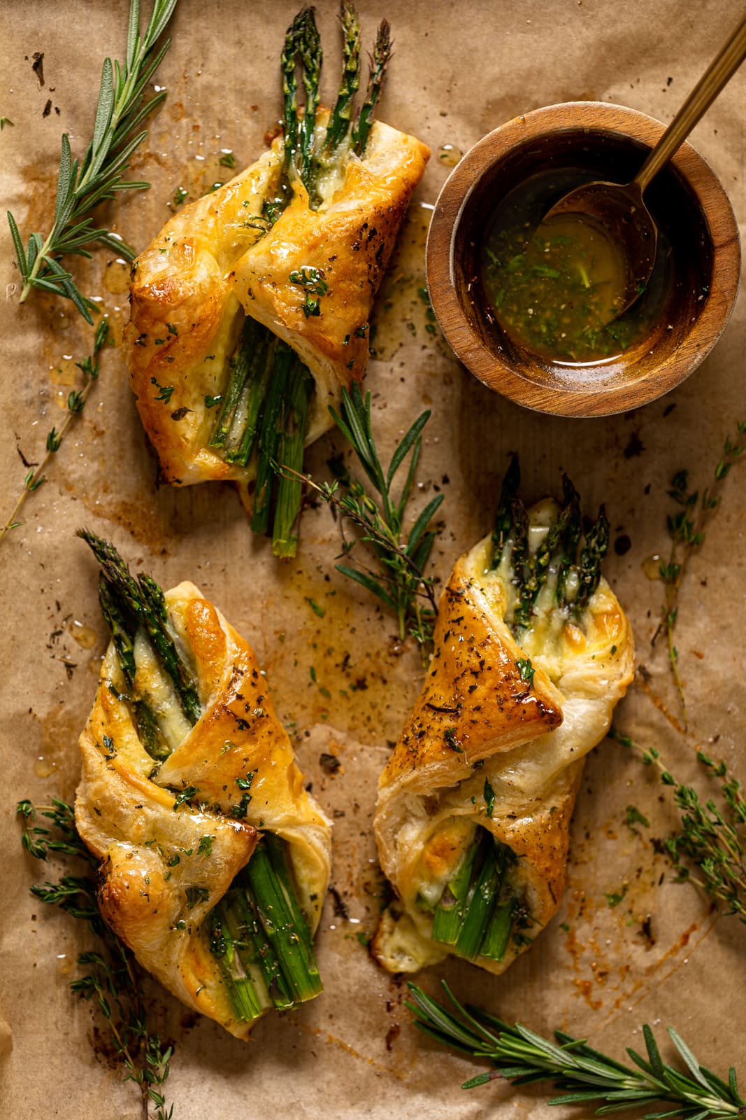 Overhead shot of Asparagus and Mozzarella Puff Pastries with Herb Honey