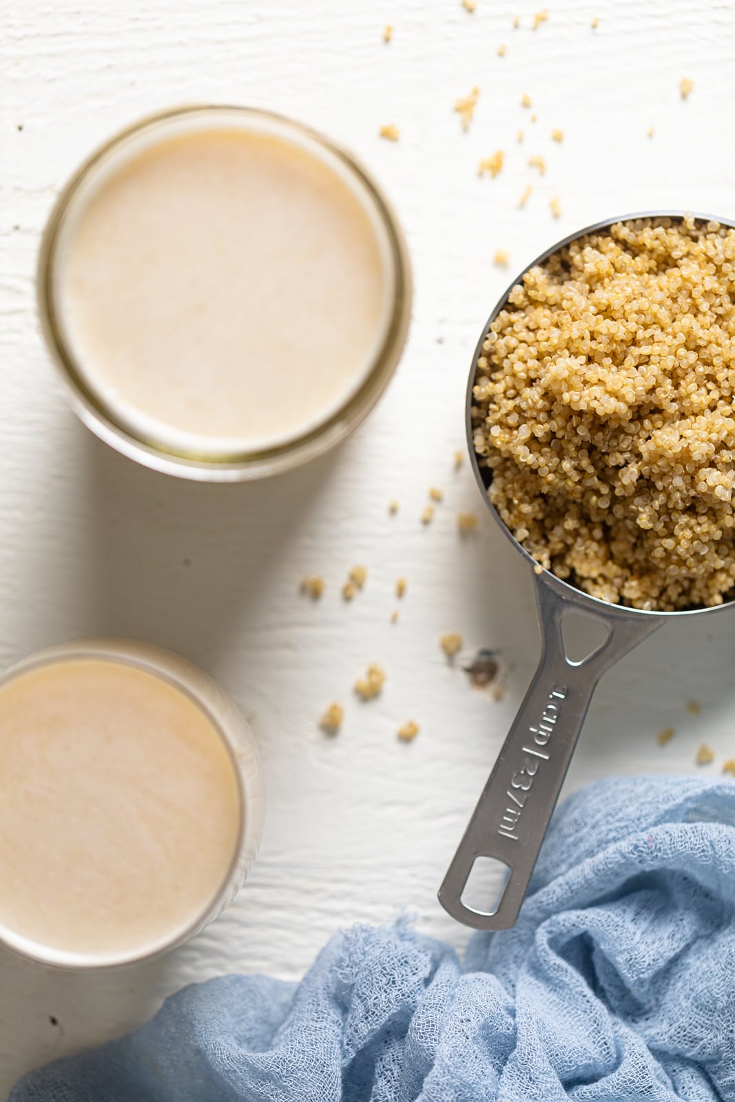 Overhead shot of cooked quinoa in a measuring cup