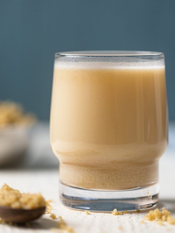 Closeup of a small glass of Quinoa Milk.