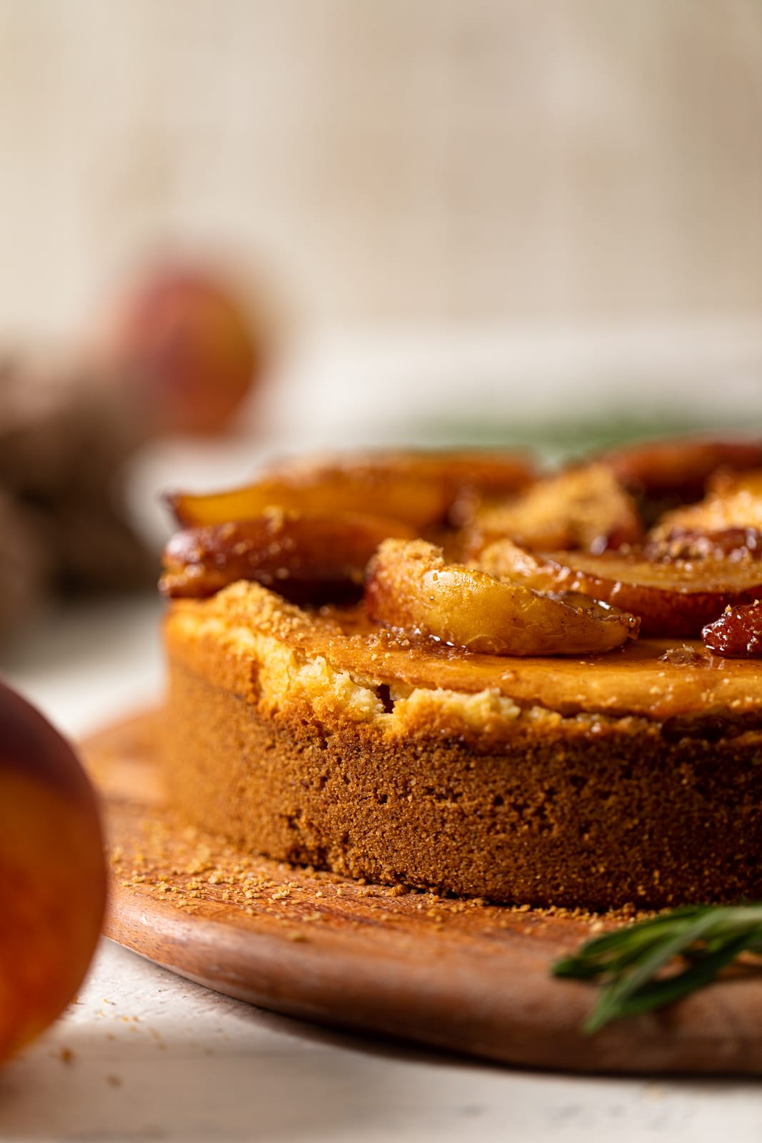 Southern Peach Cobbler Cheesecake on a wooden board