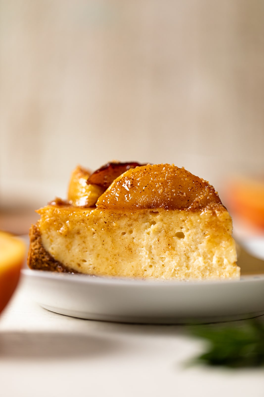 Slice of Southern Peach Cobbler Cheesecake on a small plate