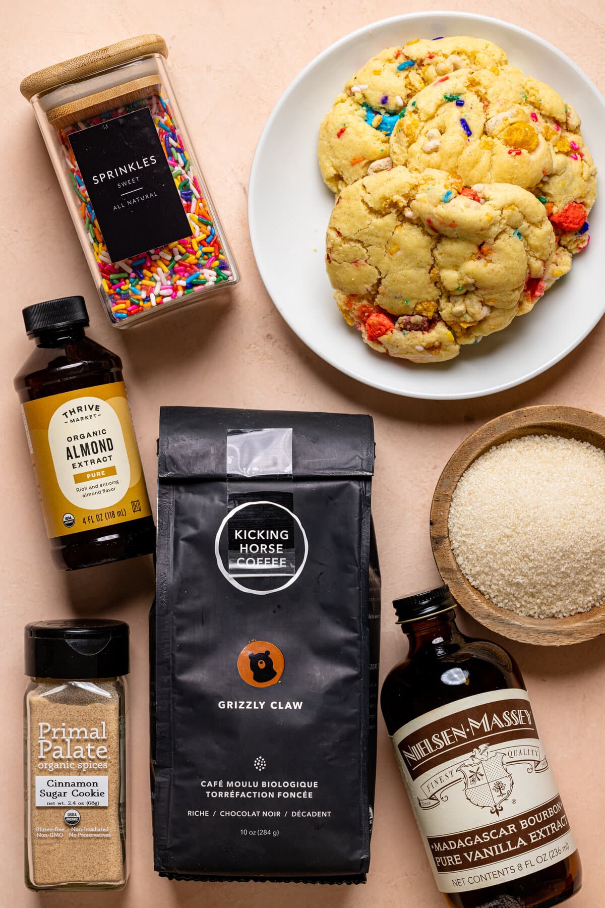 Ingredients for Starbucks Copycat Iced Sugar Cookie Latte including cookies, sprinkles, almond extract, and vanilla extract