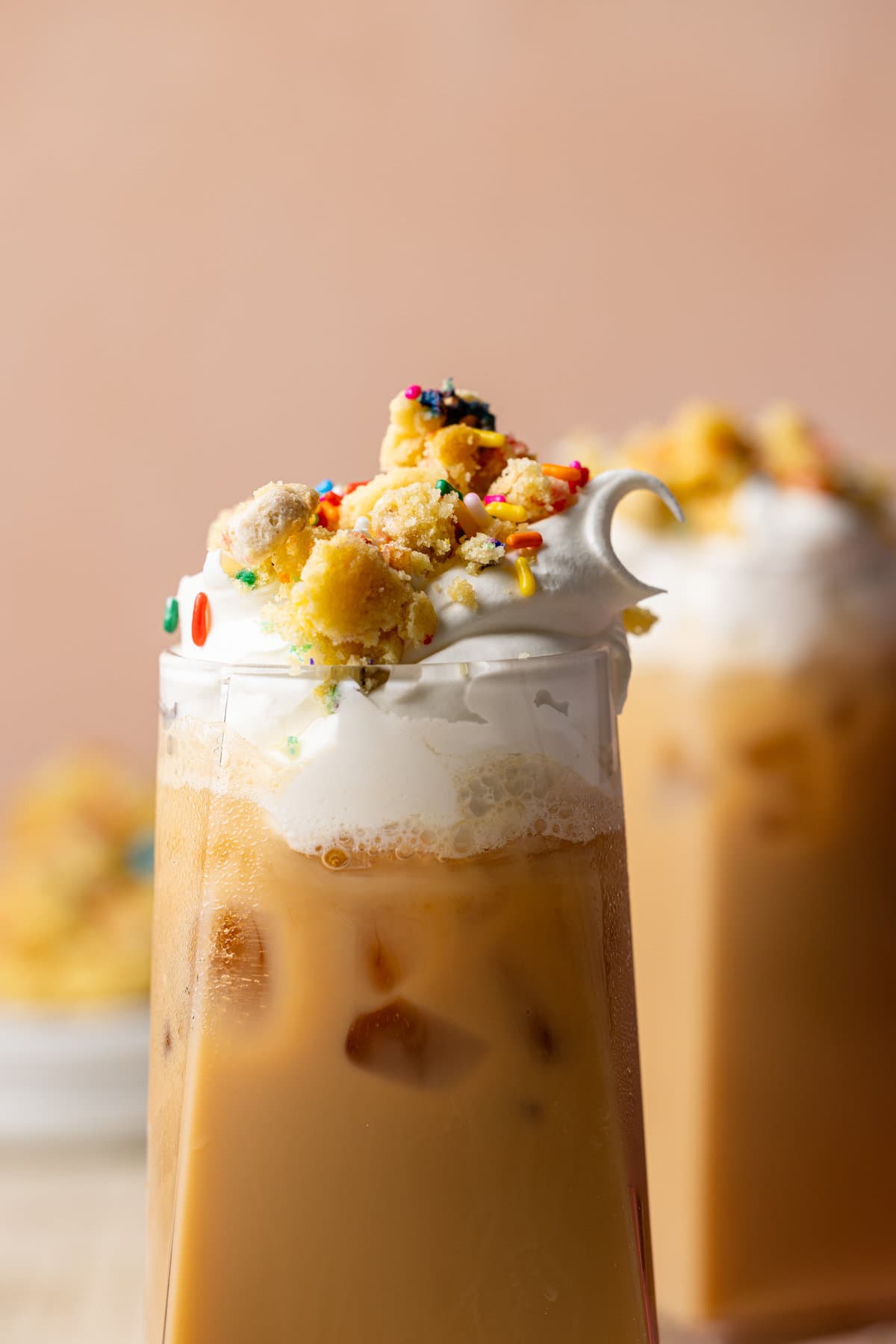 Closeup of Starbucks Copycat Iced Sugar Cookie Latte topped with cookie bits