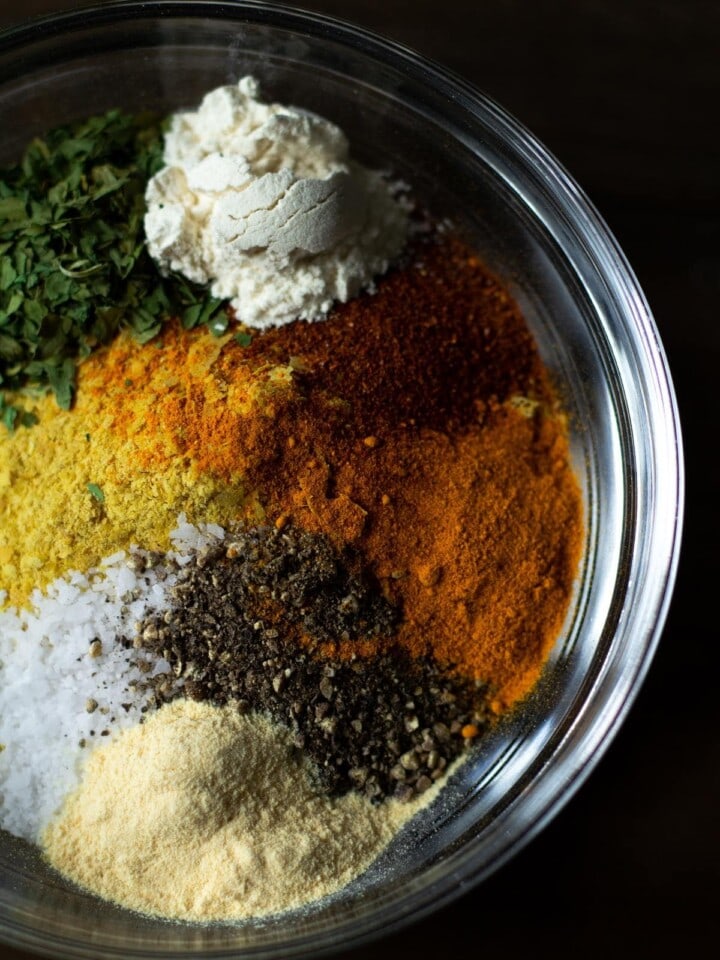 Bowl filled with different colored spices