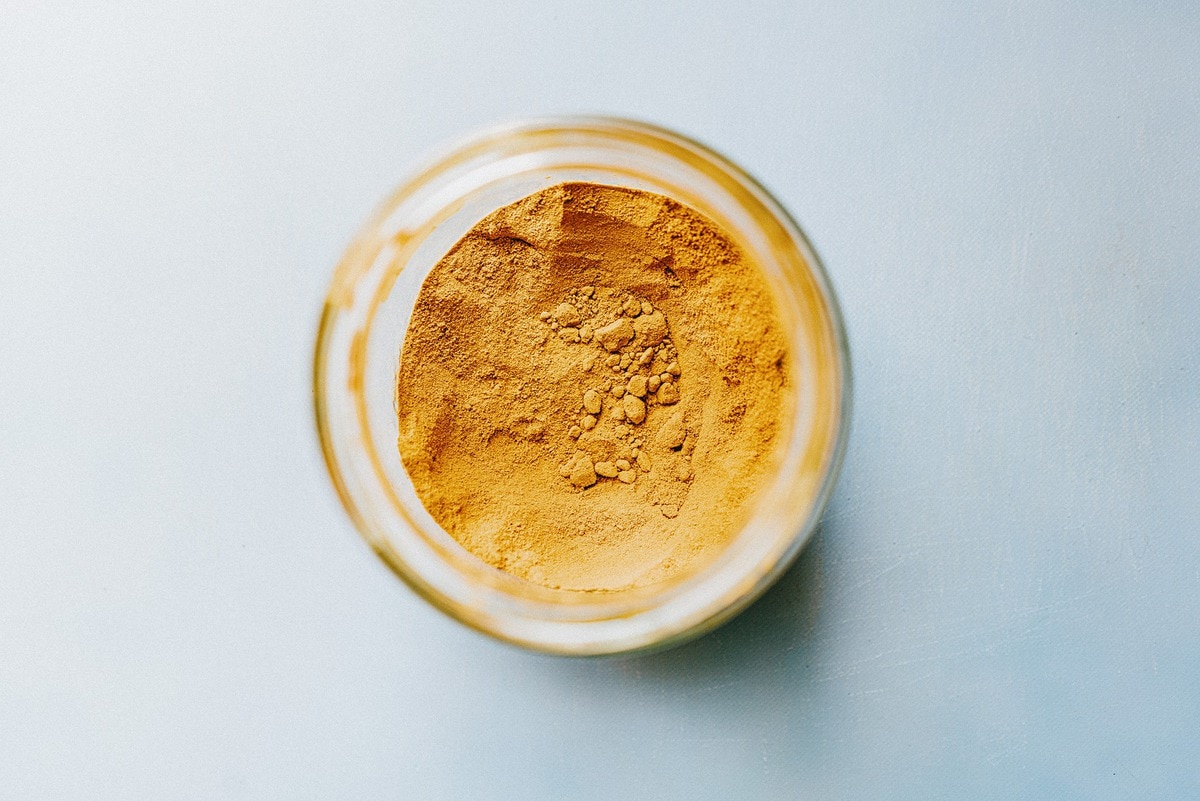 Overhead shot of a glass jar of turmeric