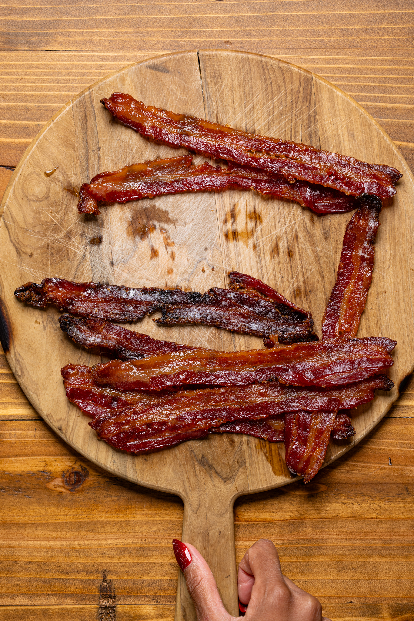 Image of candied bacon on a cutting board.
