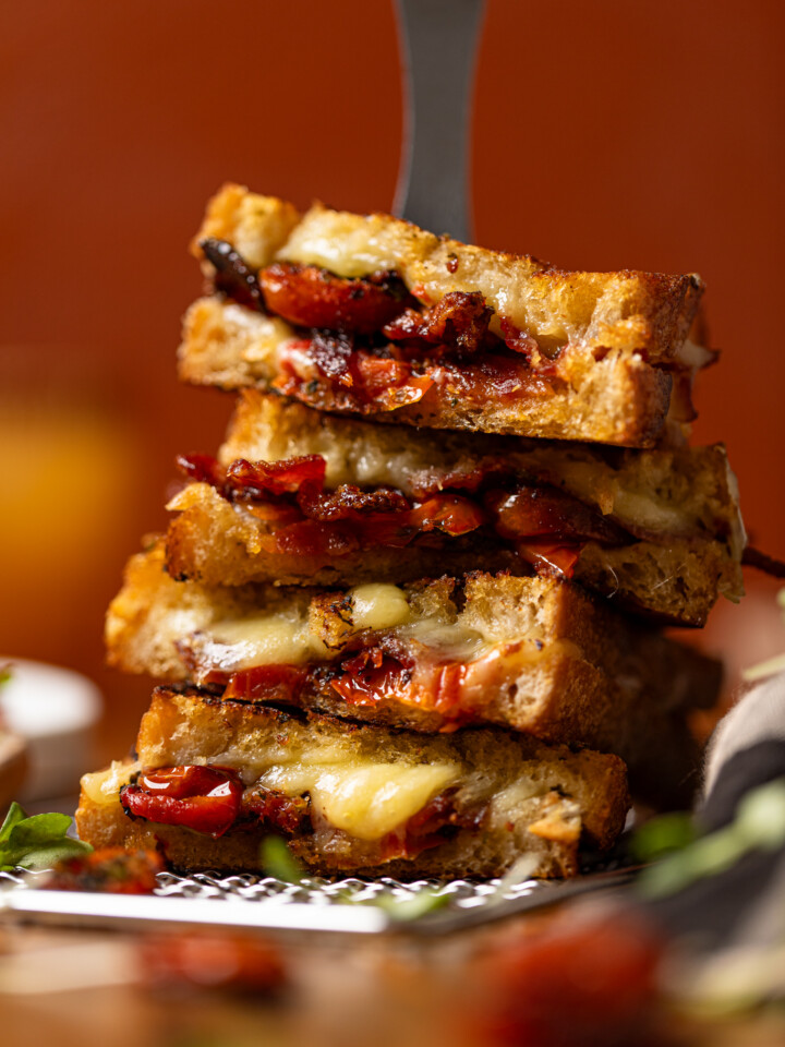 Up close shot of stacked grilled cheese sandwiches.