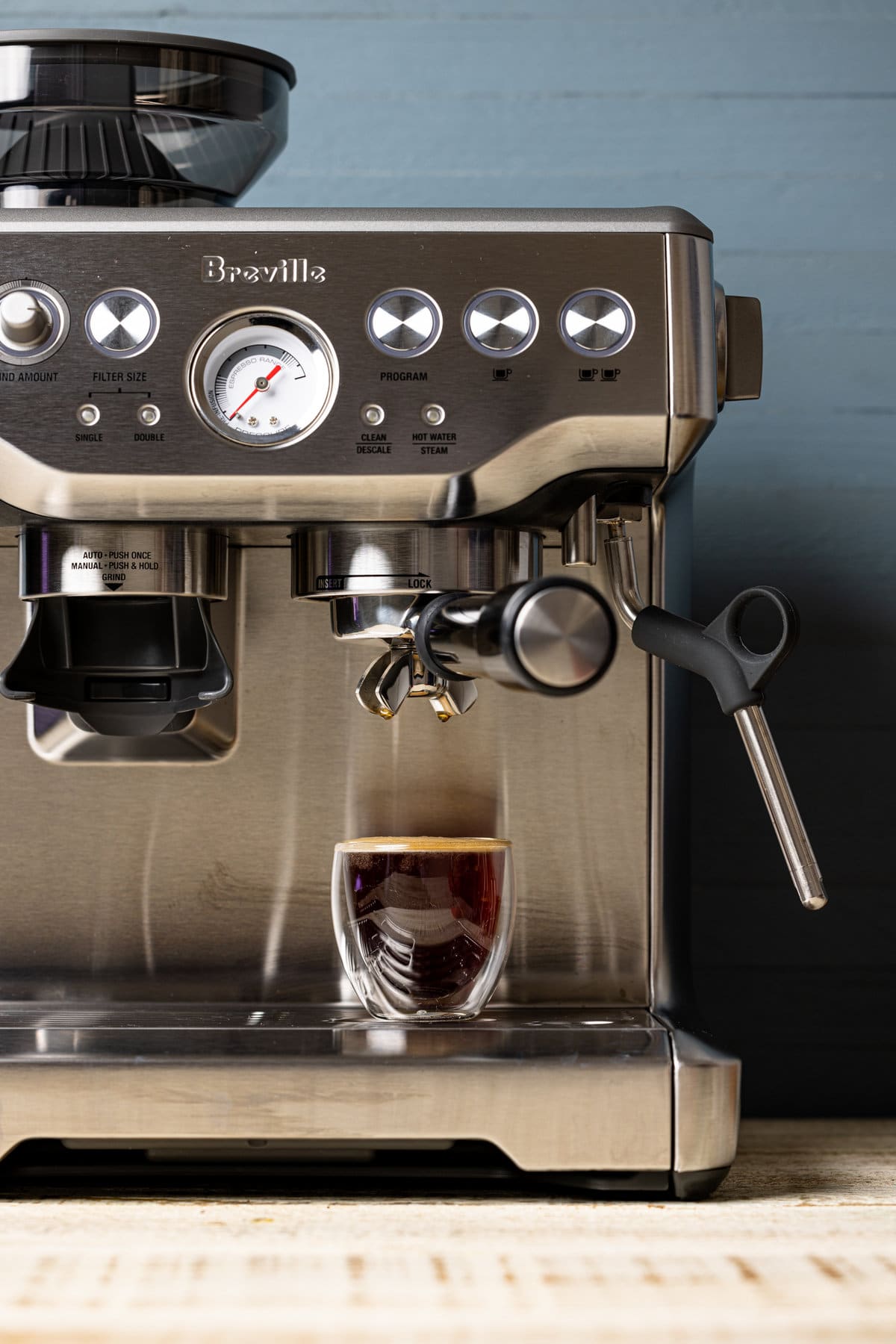 Filled cup on an espresso maker