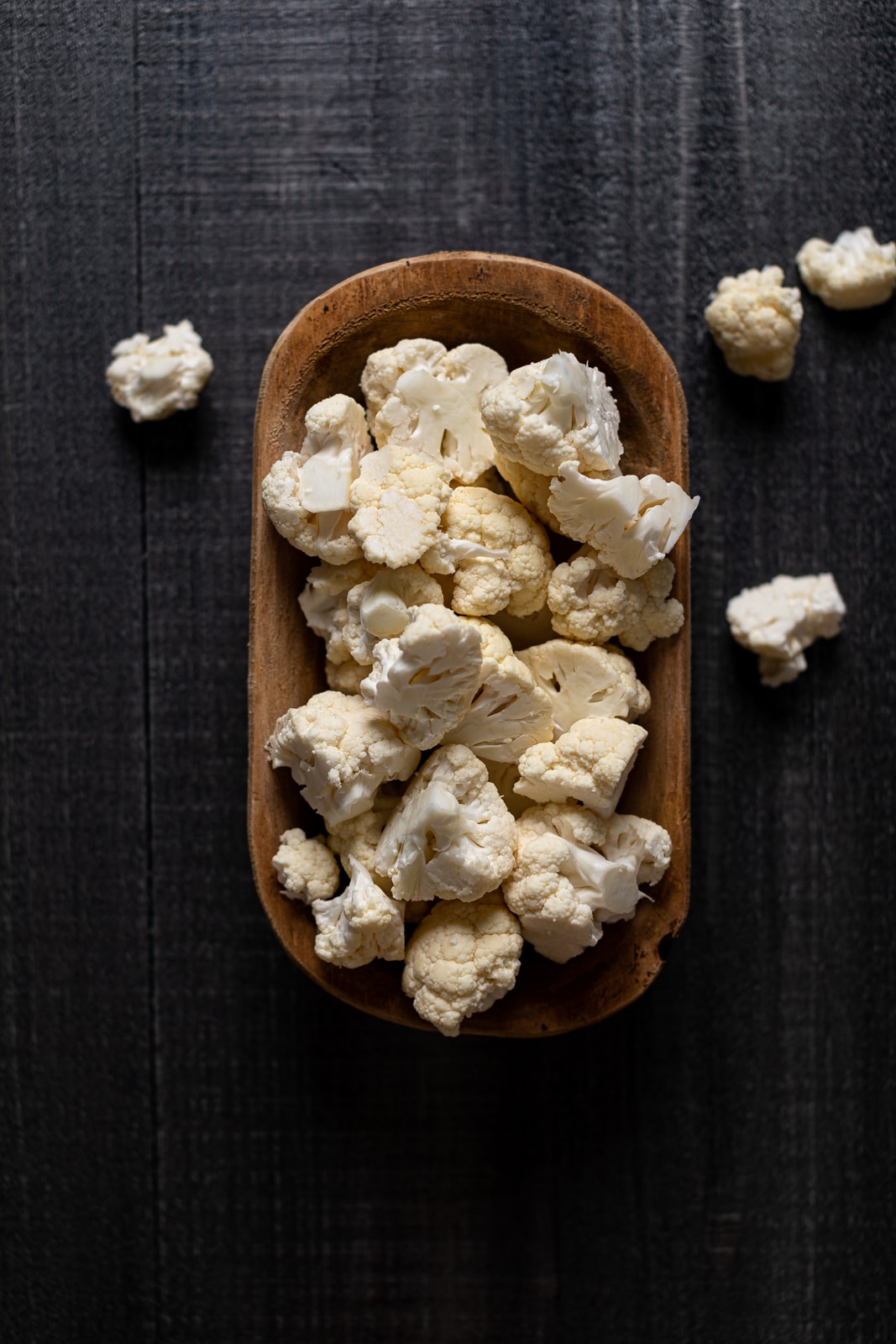 Wooden bowl of chopped cauliflower