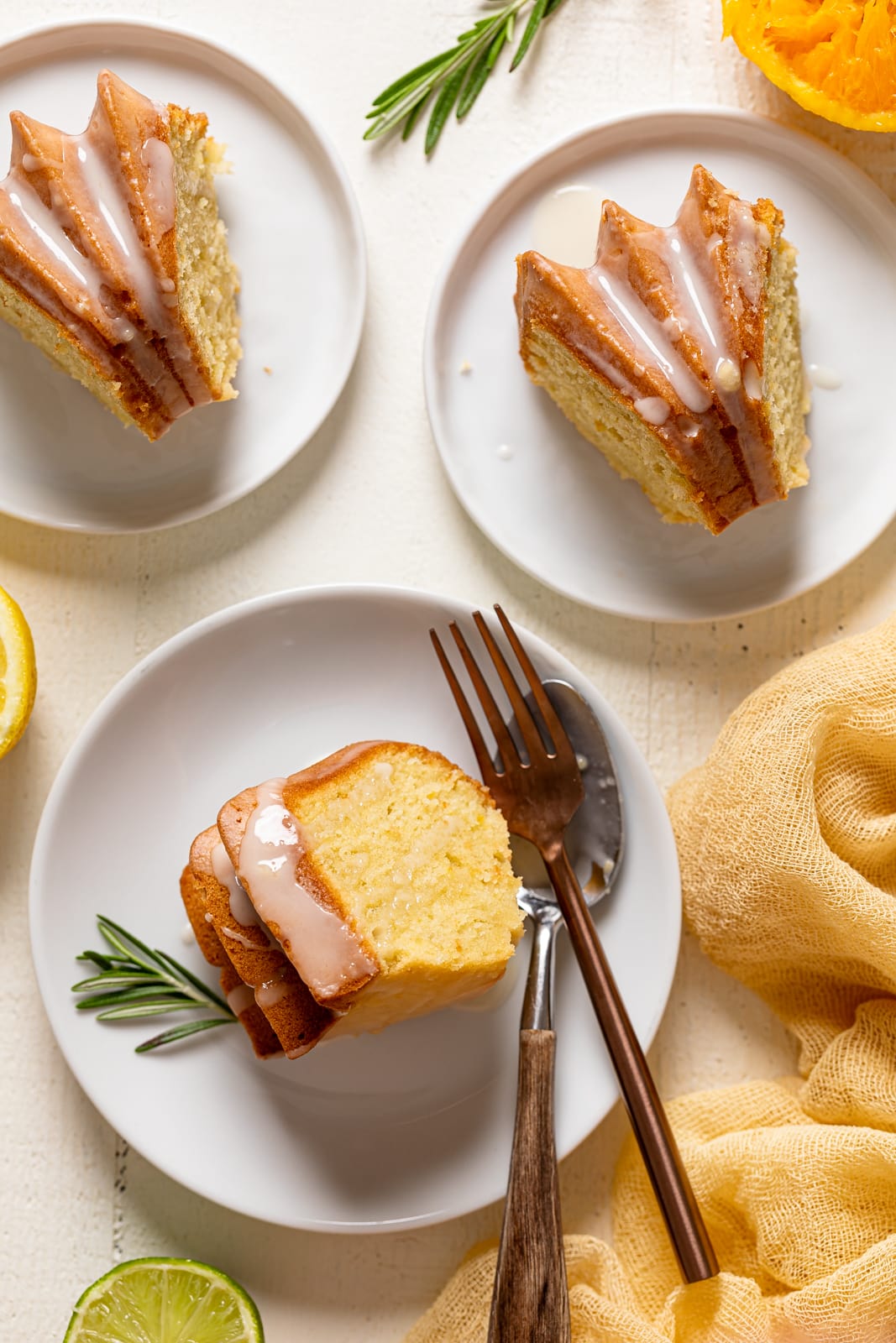 Slices of Citrus Olive Oil Bundt Cake on small plates