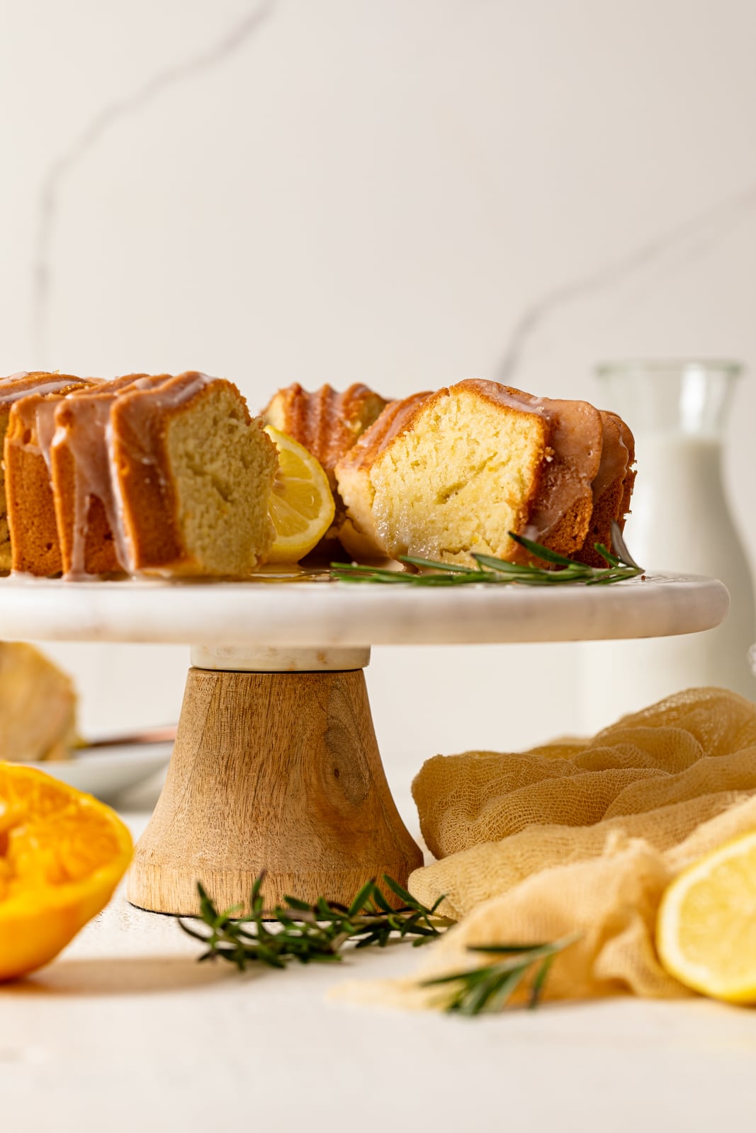 Sliced Citrus Olive Oil Bundt Cake on an elevated platter