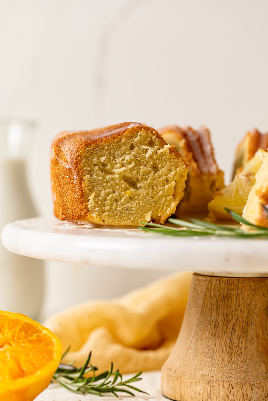 Slice of bundt on an elevated platter